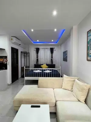 a living room with a couch and a blue ceiling at Charming Villa Suite with Cozy Terrace near Beach in Patong Beach
