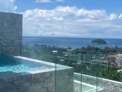 a view of the ocean from a house at The View Condominium 360 m2 Sea View Penthouse in Kata Beach