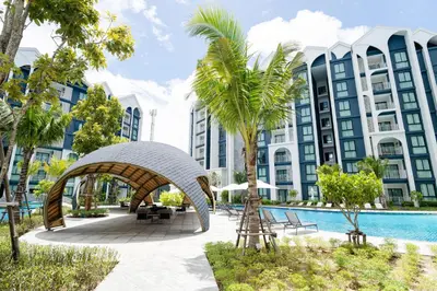 a resort with a swimming pool and a resort at Title Halo, 2 bedrooms apartment in Nai Yang Beach