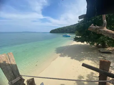 a view of a beach with a boat in the water at Private Beach Camping on island at Koh Lon Island in Ko Lon