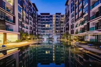 a view of a canal in a city with buildings at Royal Lee Condo in Ban Bo Han