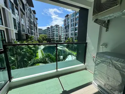 a balcony with a view of a city at Royal Lee Condo in Ban Bo Han