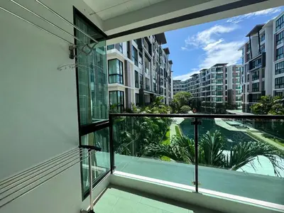 an apartment balcony with a view of a city at Royal Lee Condo in Ban Bo Han