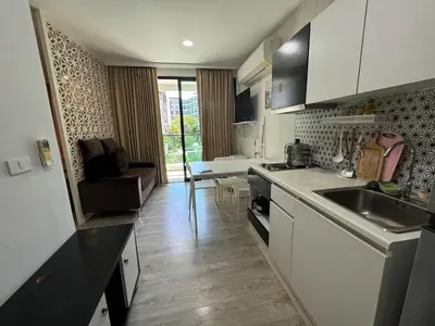 a kitchen with a sink and a counter top at Royal Lee Condo in Ban Bo Han