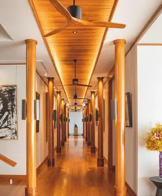 a hallway with wooden ceilings and columns in a building at Villa 7 Miramare Andara Signature - The Most Exclusive Villa in Phuket in Amphoe Thalang