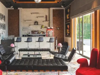 a living room with a black couch and chairs at Villa 7 Miramare Andara Signature - The Most Exclusive Villa in Phuket in Amphoe Thalang