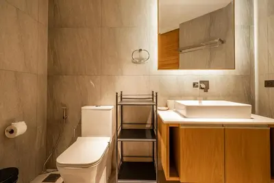 a bathroom with a white toilet and a sink at Bluepoint by Villacarte in Patong Beach