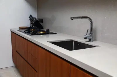 a kitchen with a sink and a stove at Bang Tao Anchan Flora 3 bd in Ban Phru Champa