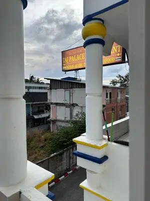 a view of a building from a balcony at Taj Palace Patong Beach in Patong Beach