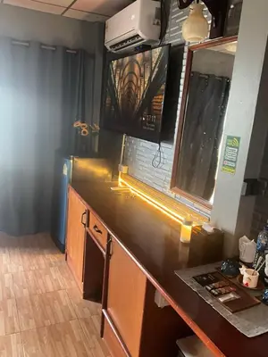 a kitchen with a counter top in a room at Sumer guesthouses in Patong Beach