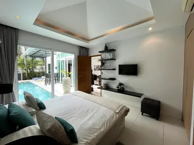 a bedroom with a bed and a swimming pool at Skylight Nice Pool Villa in Kamala in Kamala Beach