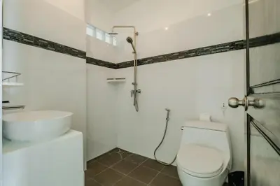 a bathroom with a toilet and a sink at Skyfall Private Pool Villa In Rawai in Rawai Beach