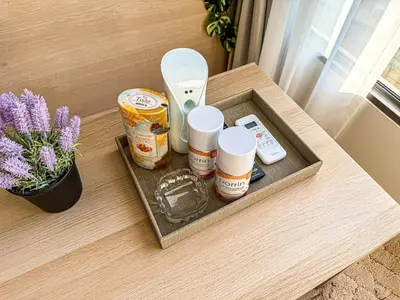 a tray with food and medicines on a table at New 1BDR Fantasea Kamala beach in Kamala Beach