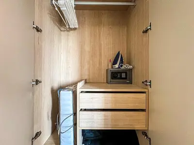 a wooden cabinet with a microwave on top of it at New 1BDR Fantasea Kamala beach in Kamala Beach