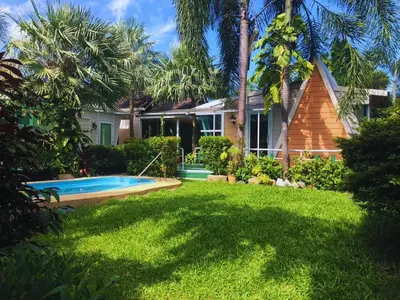 a house with a swimming pool in a yard at 2 Bedrooms House with Private Pool the heart of rawai in Ban Saiyuan (1)