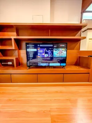 a flat screen tv sitting on a shelf at Green Place in Phuket Town