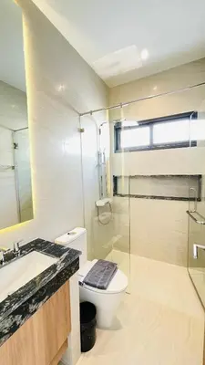 a bathroom with a toilet and a sink and a shower at Mouana Residence Song Khun Chalong 8910 in Phuket Town