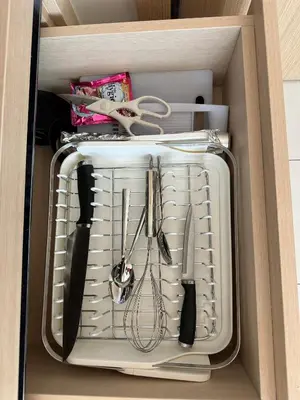 a drawer with knives and other kitchen utensils at Fantasea Condo Kamala in Kamala Beach