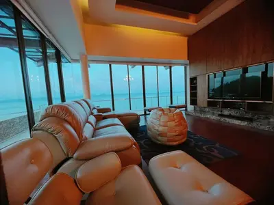 a living room with a bunch of leather couches at Rare Sunrise Cliff Villa 5 Bedrooms in Ban Lo Ti Pa (1)