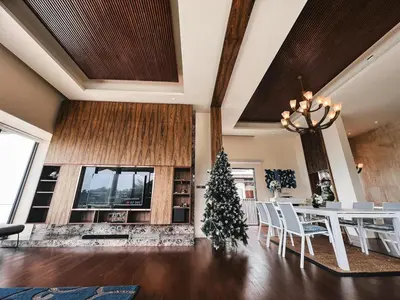 a dining room with a christmas tree and a table at Rare Sunrise Cliff Villa 5 Bedrooms in Ban Lo Ti Pa (1)
