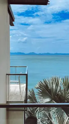 a view of the ocean from a balcony of a house at Rare Sunrise Cliff Villa 5 Bedrooms in Ban Lo Ti Pa (1)