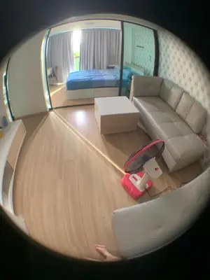 a circular view of a living room with a couch at Fab condo in Ban Tha Khreng