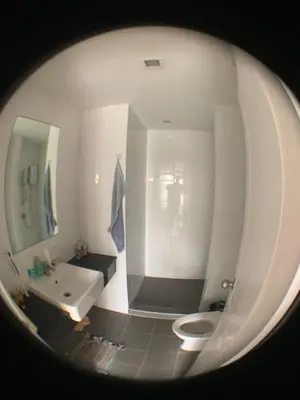a bathroom with a white toilet and a sink at Fab condo in Ban Tha Khreng