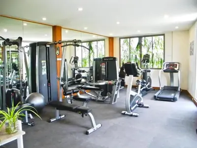 a gym with several treadmills and exercise bikes at Rawai Beach Pool Villa 3 bedrooms in Rawai Beach