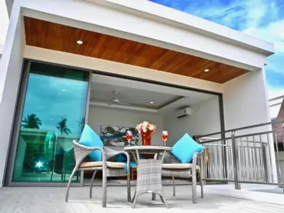 a patio with a table and chairs on a balcony at Rawai Beach Pool Villa 3 bedrooms in Rawai Beach