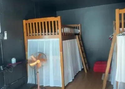 a bedroom with two bunk beds and a fan at Cat Home Ao Nang Landmark in Ao Nang Beach