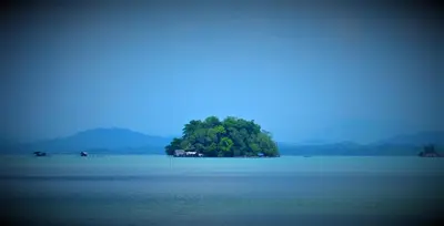 a small island in the middle of a large body of water at Villa Tha Maphrao in Ban Pa Khlok