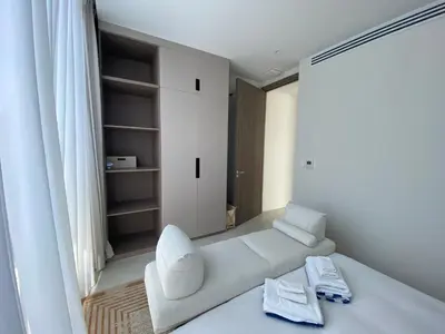 a white living room with a white couch and a shelf at 3bdr New Modern Pool Villa Bangtao ASH-05 in Ban Phru Champa