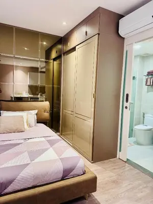 a bedroom with a bed and a bathroom with a tub at Luxury 2 Person Apartment in Heart of Phuket in Ban Ket Ho