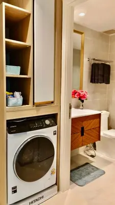 a kitchen with a washing machine in a cabinet at Luxury 2 Person Apartment in Heart of Phuket in Ban Ket Ho