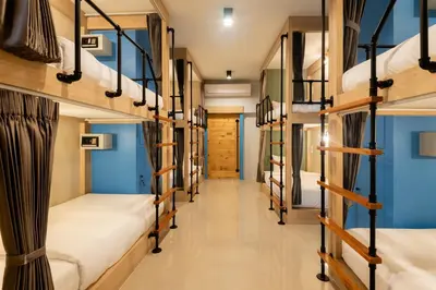a hallway with bunk beds in a hostel at Kewalin hostel in Phi Phi Don