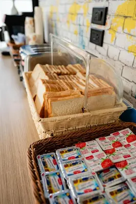 a basket full of sandwiches and bread at Kewalin hostel in Phi Phi Don