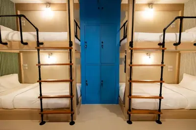 two sets of bunk beds in a room at Kewalin hostel in Phi Phi Don