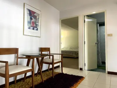 a room with a table and chairs and a bedroom at 3-bed house with Private beach in Ban Ao Makham