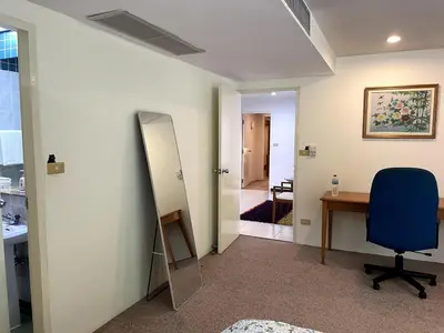 an office with a mirror and a desk and a chair at 3-bed house with Private beach in Ban Ao Makham