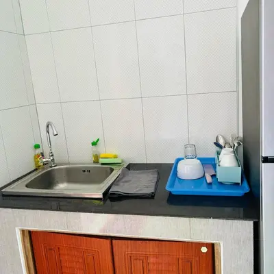 a kitchen counter top with a sink and a counter top at Lamsai AC Sea House Green in Ko Yao Noi