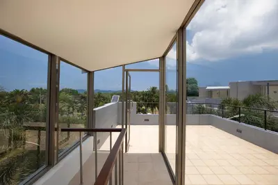 a view from the balcony of a house at Modern Comfort in Paradise - Villa Argent 6 with 3BR and Access to Tropical Pool in Thalang