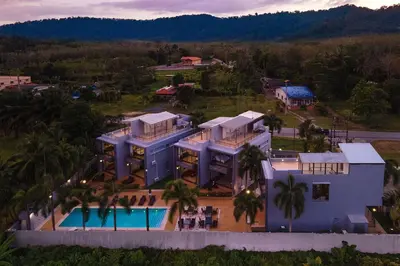 an aerial view of a house with a swimming pool at Modern Comfort in Paradise - Villa Argent 6 with 3BR and Access to Tropical Pool in Thalang