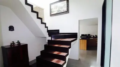 a stairway in a house with a stair case at Villa Loma 4 Chambres in Patong Beach