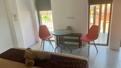 a living room with a couch and two chairs and a table at Villa Loma 4 Chambres in Patong Beach