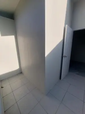 an empty room with a door and a tile floor at 629 Home for rent, Rawai in Ban Saiyuan (1)