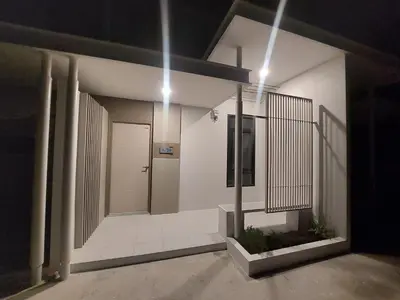 a hallway of a building with a door and lights at 629 Home for rent, Rawai in Ban Saiyuan (1)