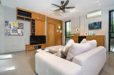 a living room with a white couch and a ceiling fan at Nature & Serenity - Exclusive Villa-Pavilion P06 in Natural Park Residence near Kamala Beac in Kamala Beach