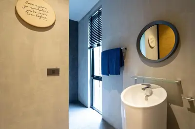 a bathroom with a sink and a mirror at Nature & Serenity - Exclusive Villa-Pavilion P06 in Natural Park Residence near Kamala Beac in Kamala Beach