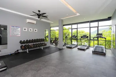 a gym with a lot of treadmills and ellipticals at Nature & Serenity - Exclusive Villa-Pavilion P06 in Natural Park Residence near Kamala Beac in Kamala Beach
