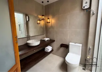 a bathroom with a sink and a toilet at 202 HOUSE near Bangtao Muay Thai & MMA in Ban Thalat Choeng Thale